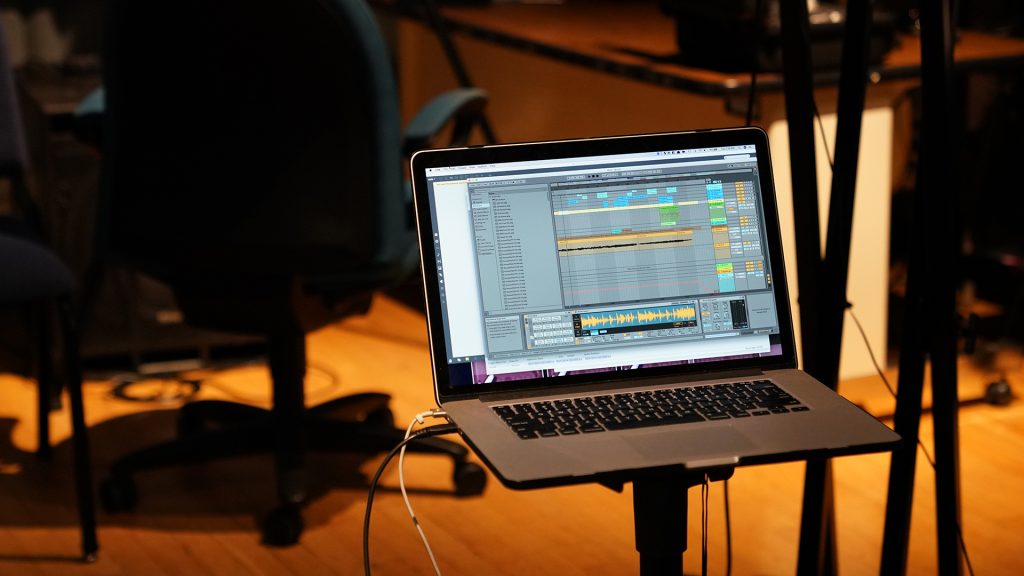 Laptop with audio editing on the screen